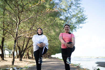 Rear view of couple walking on road