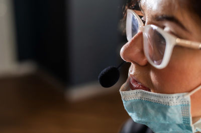 Close-up portrait of woman wearing eyeglasses