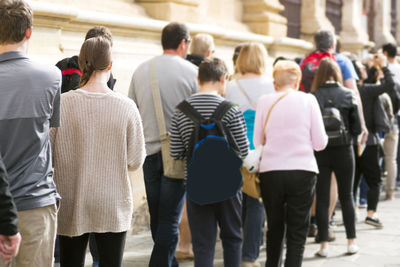 People queue in line, selective focus