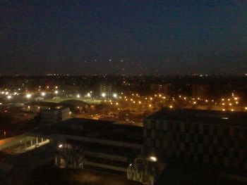 View of illuminated city at night