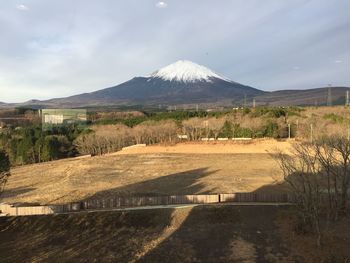 View of landscape against cloudy sky