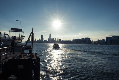 Scenic view of sea and buildings against sky