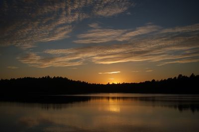 Scenic view of silhouette trees against sky during sunset