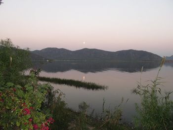 Scenic view of lake with mountains in background