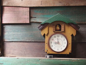 Close-up of clock on table