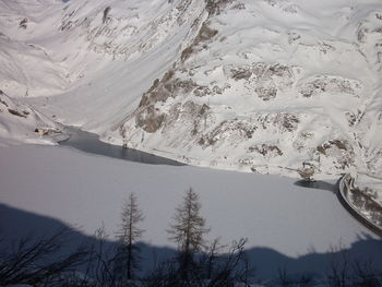 High angle view of snowcapped mountains and lake