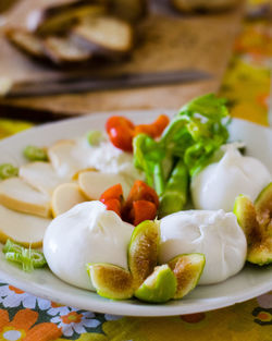 Close-up of fruits in plate on table