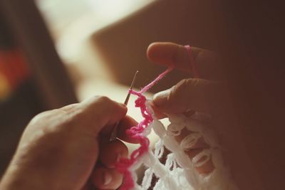 Cropped hands knitting crochet at home