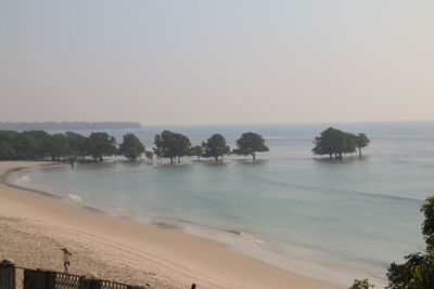 Scenic view of beach against clear sky