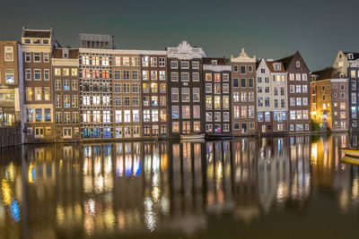 Reflection of illuminated buildings in canal at night