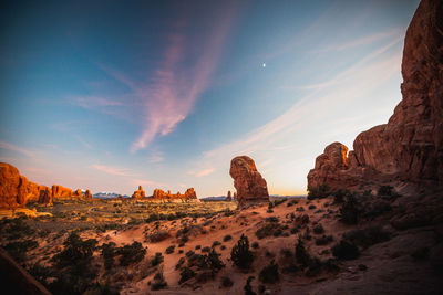 Panoramic view of rock formations on landscape against sky