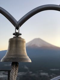 Close-up of metal structure against sky