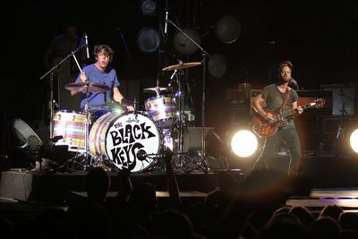 Group of people playing guitar at music concert