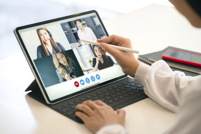 Midsection of woman using mobile phone