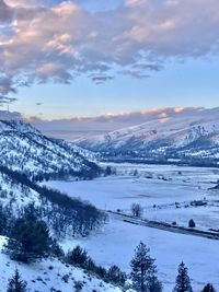 Scenic view of snowcapped mountains against sky during sunset