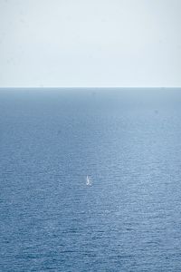 High angle view of boat sailing in sea against sky