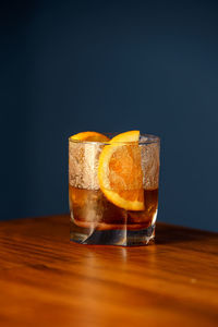 Close-up of drink on table against black background