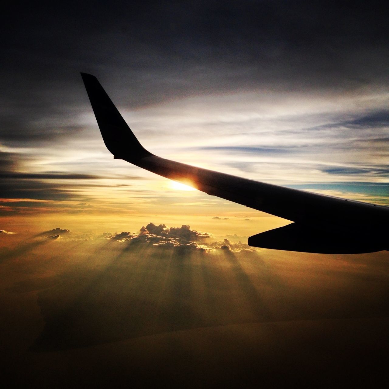 airplane, transportation, flying, aircraft wing, air vehicle, mode of transport, sky, part of, mid-air, cropped, sunset, travel, cloud - sky, on the move, aerial view, airplane wing, journey, scenics, beauty in nature, nature