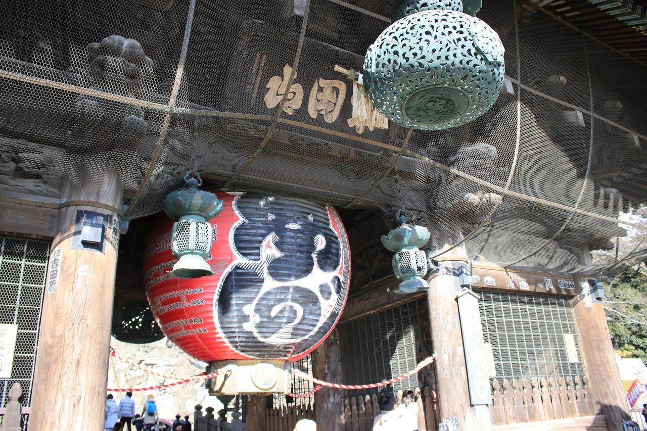 LOW ANGLE VIEW OF LANTERNS HANGING BY BUILDING