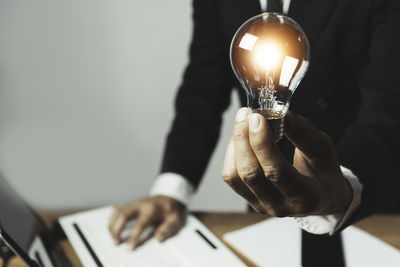 Man holding light bulb