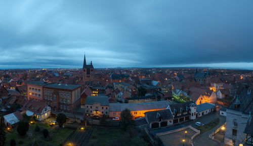 High angle view of illuminated buildings in city