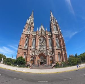 Low angle view of building against blue sky