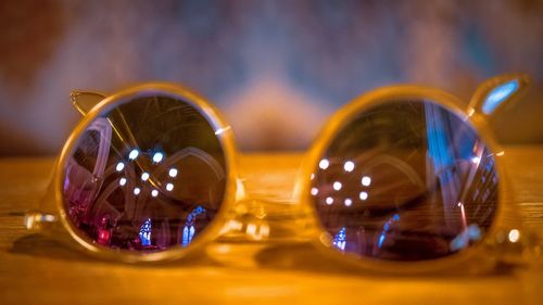 Close-up of illuminated lighting equipment on table