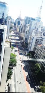 High angle view of city street and buildings against sky