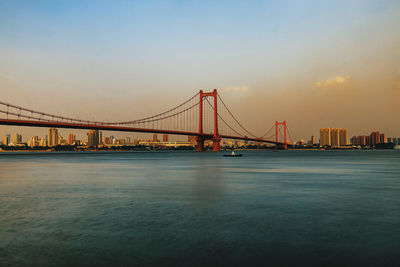 View of suspension bridge in city