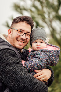 Portrait of father with baby