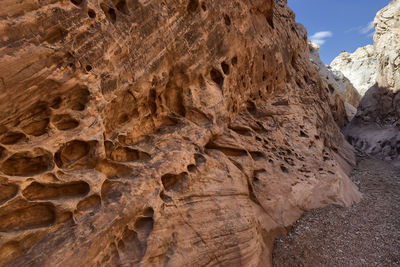 Low angle view of rock formation in desert against sky