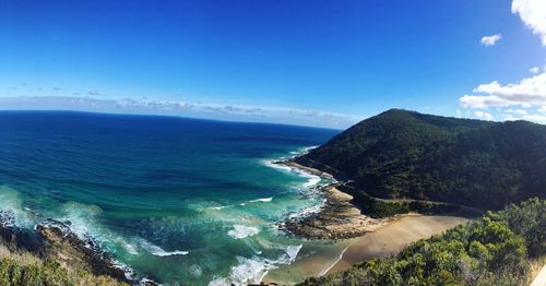 Scenic view of sea against blue sky