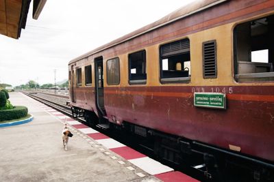 Train at railroad station against sky