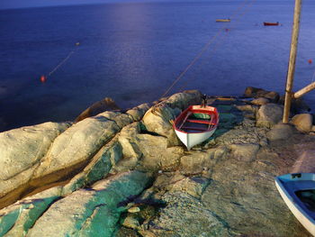 High angle view of fishing boats moored on shore