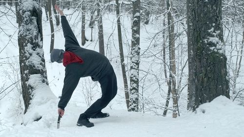 Full length of person on snow covered field