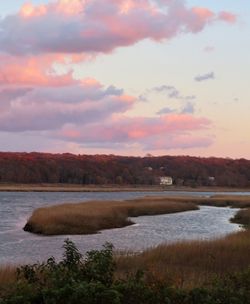 Scenic view of lake against sky during sunset