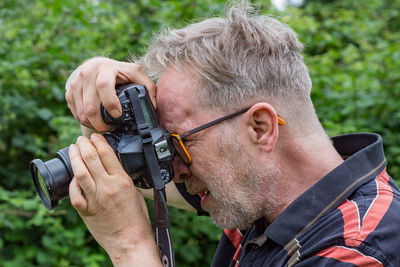 Portrait of man photographing