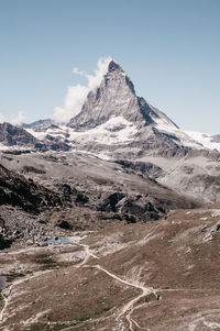 Scenic view of snowcapped mountains against sky