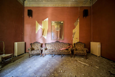 Full length of abandoned house on table at home