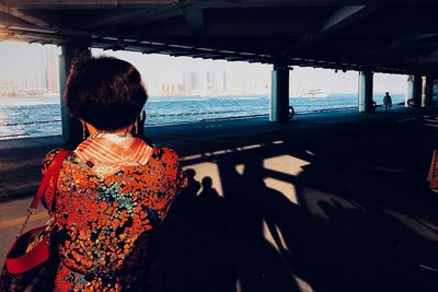 Rear view of woman looking at sea