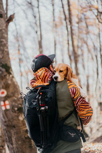 Rear view of man with dog