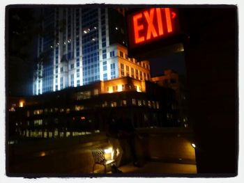 Buildings in city at night