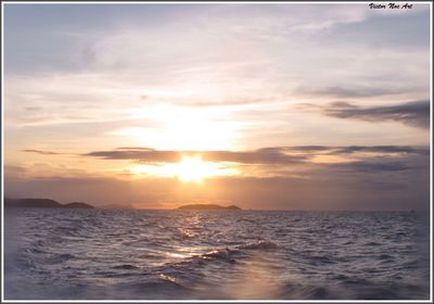 Scenic view of sea at sunset