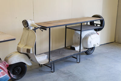 Vintage car on floor against wall