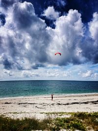 Scenic view of sea against cloudy sky