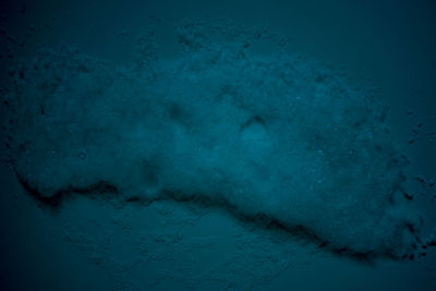 Close-up of frozen sea against sky
