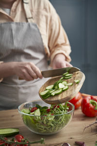 Midsection of man preparing food