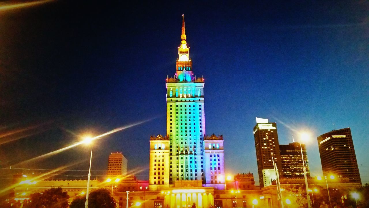 illuminated, building exterior, architecture, night, built structure, city, tower, skyscraper, tall - high, low angle view, modern, capital cities, travel destinations, office building, famous place, spire, international landmark, city life, travel, tourism