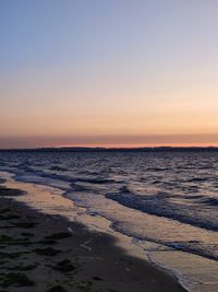 Scenic view of sea against clear sky during sunset