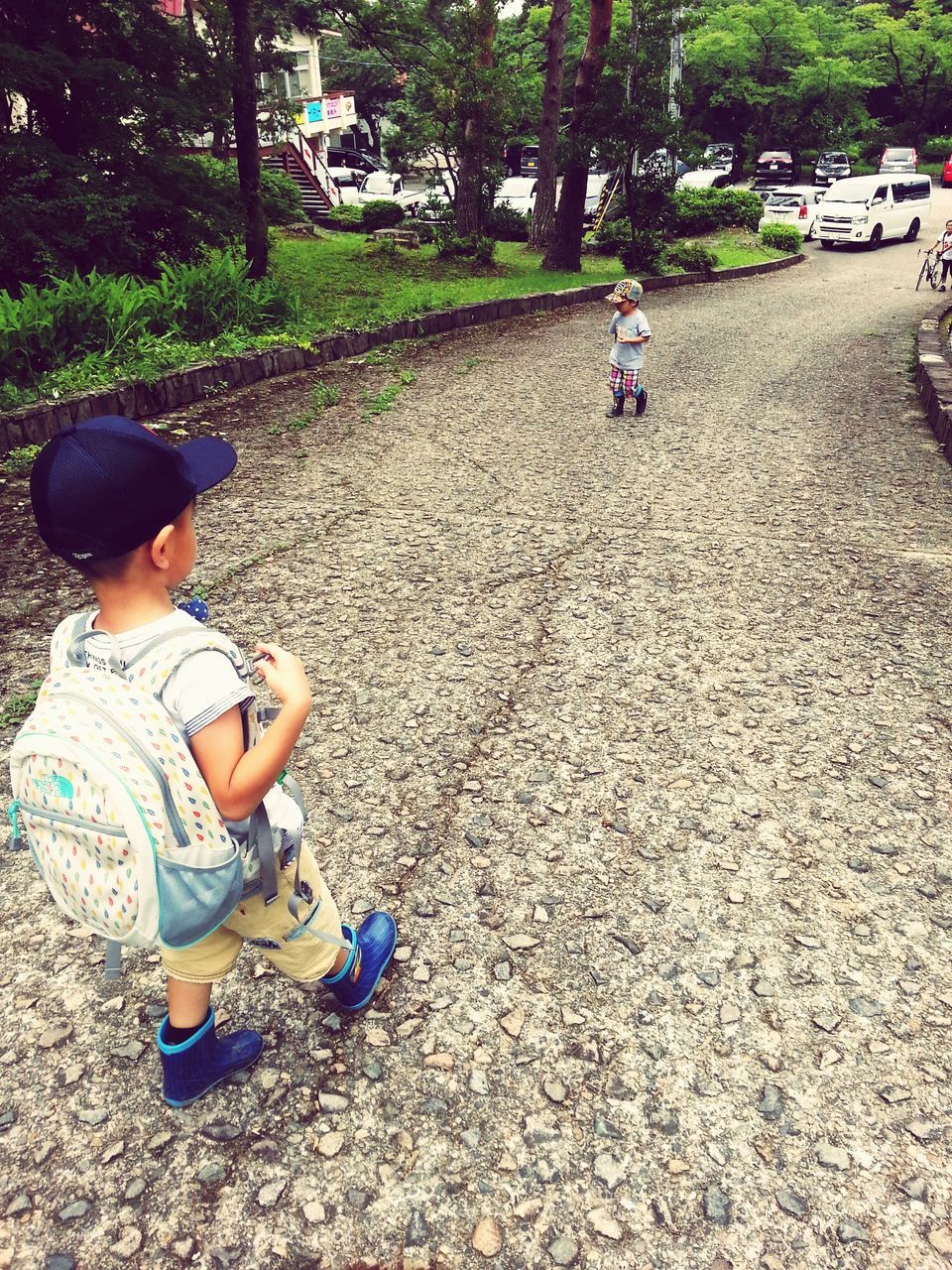 lifestyles, leisure activity, childhood, full length, casual clothing, boys, men, elementary age, girls, togetherness, sunlight, tree, transportation, street, day, outdoors, innocence